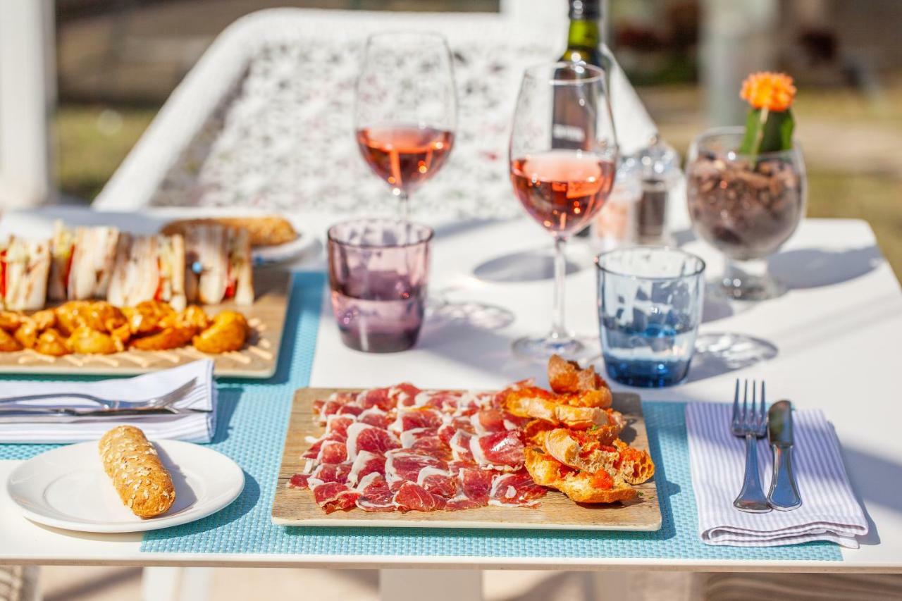 Grupotel Parc Natural & Spa Playa de Muro  Exterior photo A typical tapas bar table
