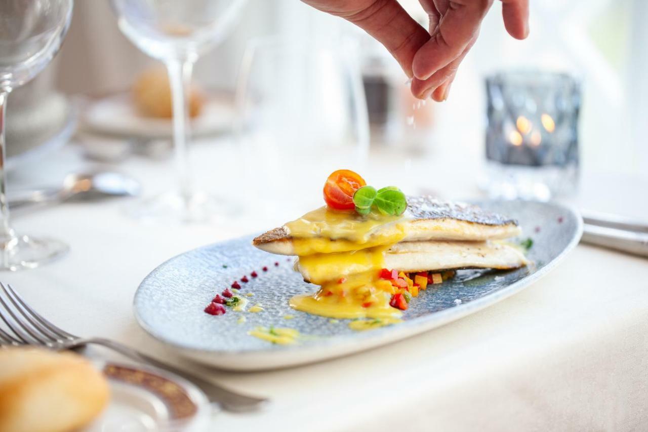 Grupotel Parc Natural & Spa Playa de Muro  Exterior photo A chef seasoning a dish